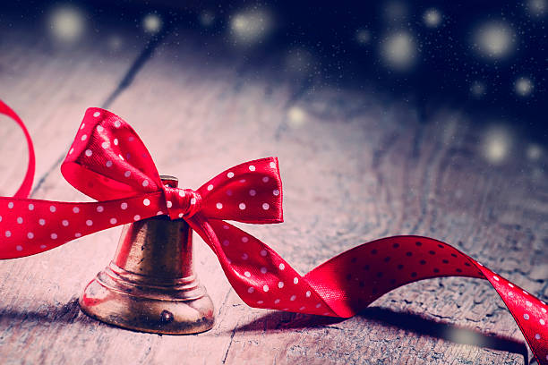istock Jingle bells with a red ribbon with polka dots 493581458