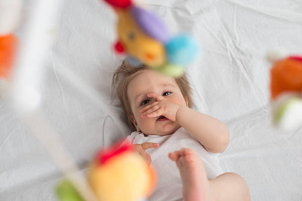 istock Baby boy with finger in the mouth 493582410
