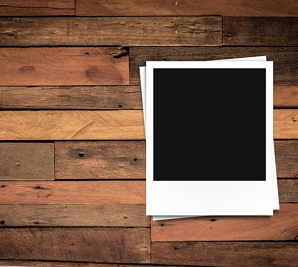 istock photo frame on brown wood plank background 493582964
