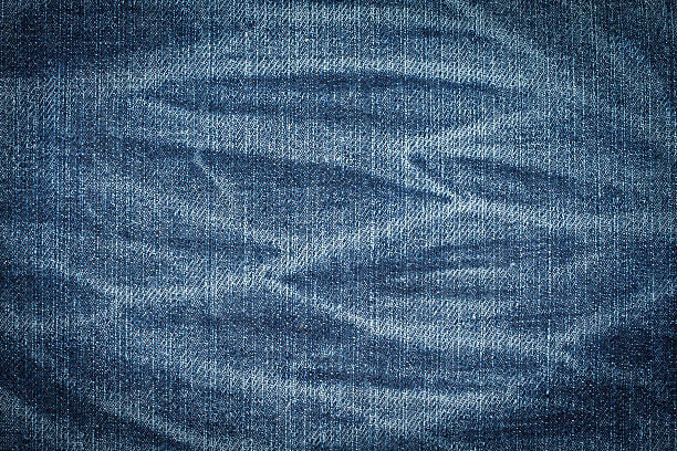 istock texture of blue jeans background 493595034