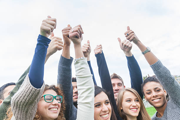 istock Multiethnic group of friends with thumbs up 493595496