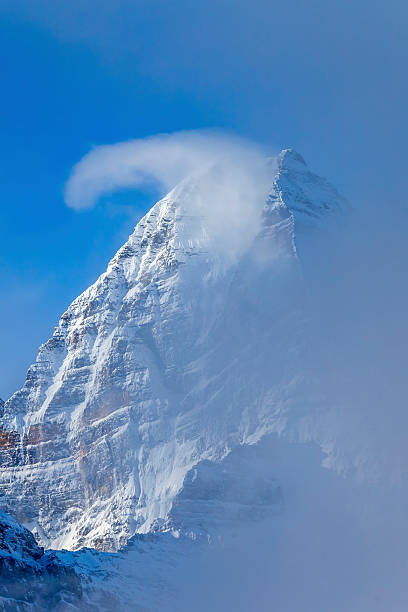 istock Pyramid Shaped Mount Assiniboine in the Fog 493597760