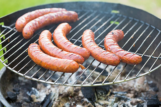 istock Tasty polish sausage on grill 493597778