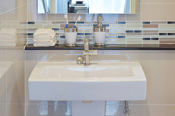 istock Lavatory and accessories with mosaic wall under the mirror 493599172