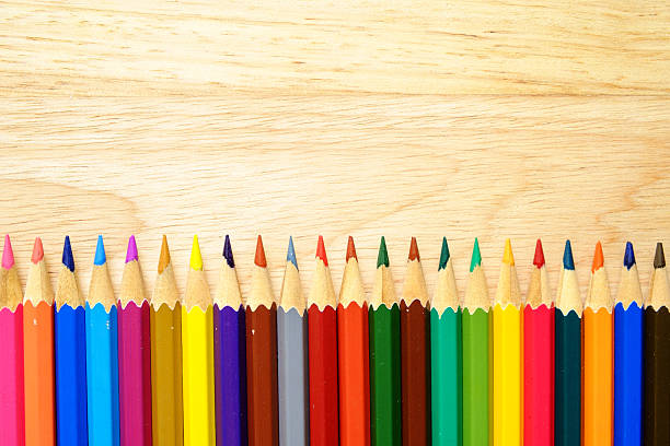 istock Color pencils on wood background 493600610