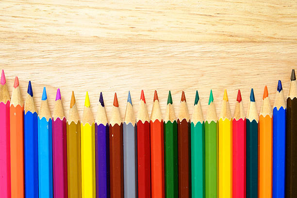 istock Color pencils on wood background 493600658