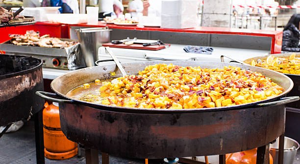 istock Cooking paella in large pot 493601604