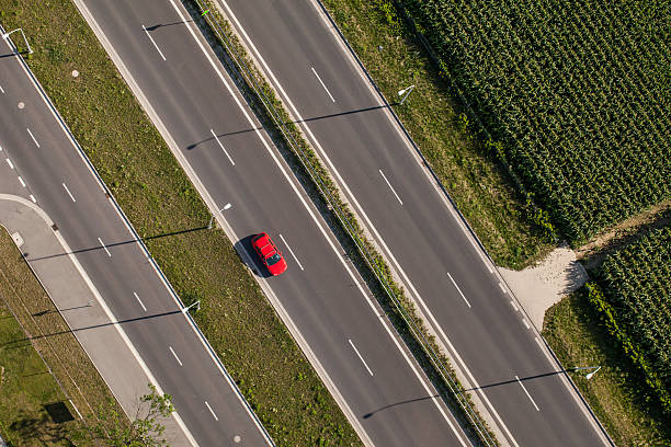 istock aerial view of highway with green fields 493605436