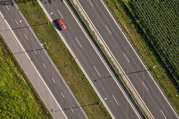 istock aerial view of highway with green fields 493605510