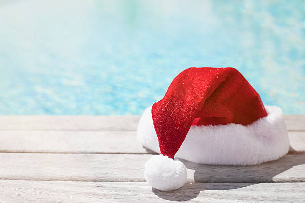 Red Christmas hat sitting by the pool