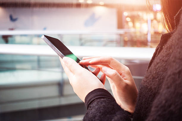 istock Close-up of woman's hands with smartphone 493607428