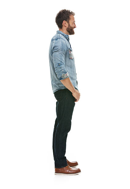 istock Smiling casual man standing and looking away 493608360