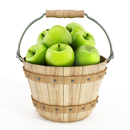 Green apples in the wooden basket.