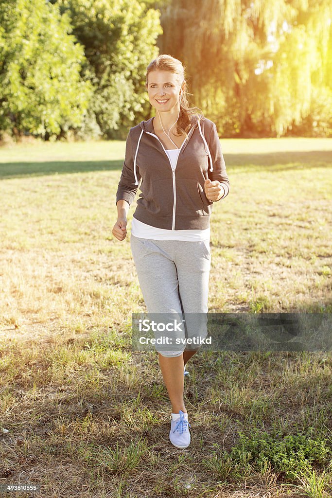 Woman outdoors. Woman enjoying walking outdoors in park. 30-39 Years Stock Photo