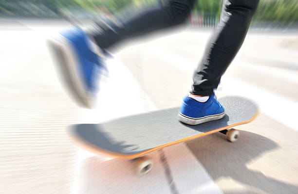 istock speeding skateboarding woman 493610733