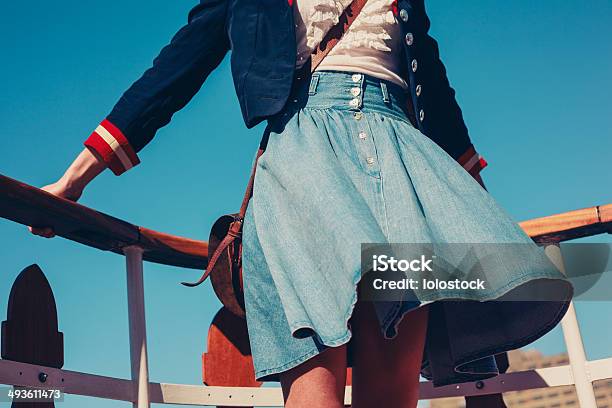 Young Woman On The Deck Of Ship With Skirt Blowing Stock Photo - Download Image Now - Fashion, One Woman Only, Sailing