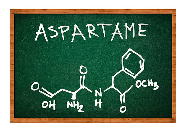 Aspartame chemical formula on school chalkboard Aspartame chemical formula on school chalkboard isolated on white background chemical formula for aspartame stock pictures, royalty-free photos & images