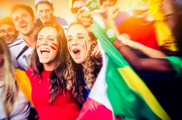 istock Fans of different nations at the stadium together 493615311