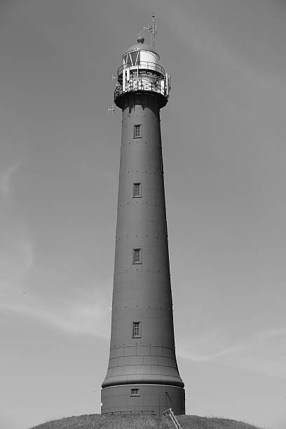 Lighthouse IJmuiden Black and White One of the two cast iron lighthouses in IJmuiden, The Netherlands, built in 1878. arma-globalphotos stock pictures, royalty-free photos & images