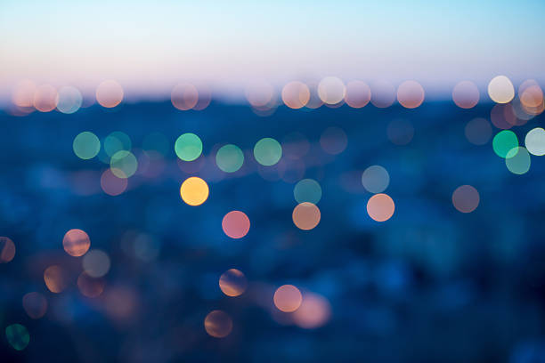 istock city lights abstract circular bokeh on blue background 493616067