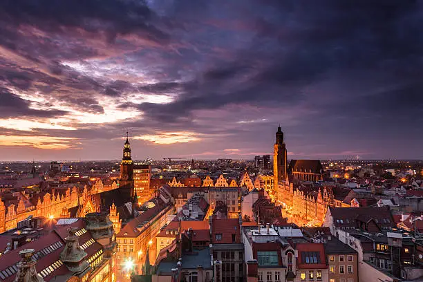 Photo of Illuminated city skyline at night, Wroclaw, Poland, Europe.