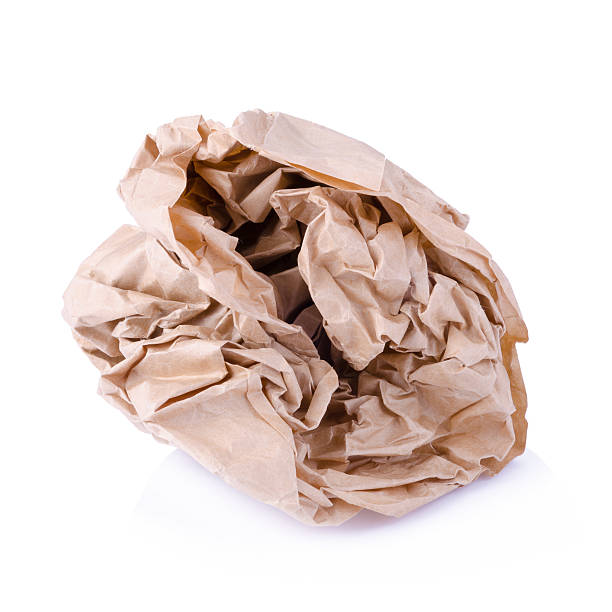 istock Crumpled brown paper balls isolated on white 493619152