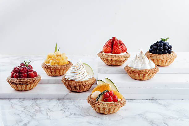 istock Close up of fruit tarts and various desserts 493620374