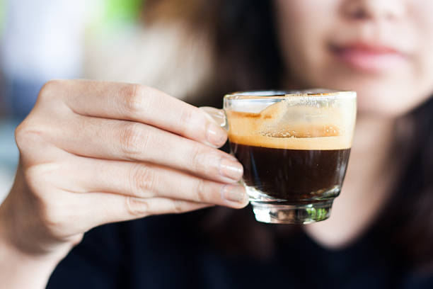 istock close up woman handing coffee cup espresso 493620722