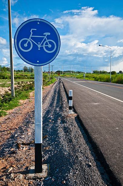 istock sign for bicycle way at public park 493621916