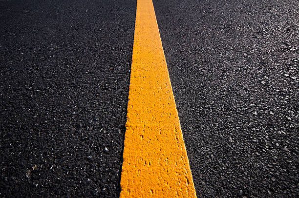 istock Asphalt road with separation yellow lines 493622854