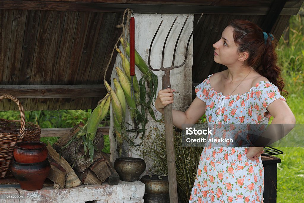 beautiful girl with a pitchfork 2015 Stock Photo