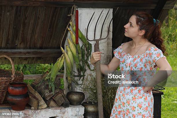 Beautiful Girl With A Pitchfork Stock Photo - Download Image Now - 2015, Adult, Arts Culture and Entertainment