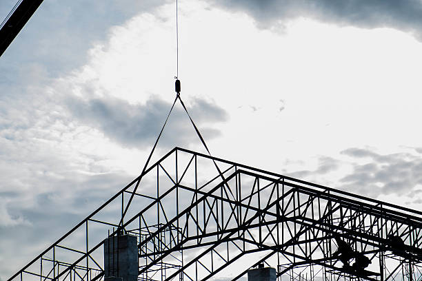 istock Silhouette under construction of roof's steel frame 493622956