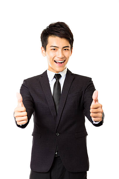 istock young business man with thumbs up gesture 493623028