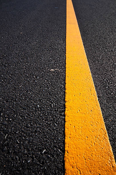istock Asphalt road with separation yellow lines 493623150