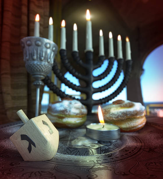 hanukkah background with candles, donuts, spinning top stock photo