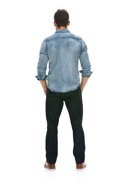 istock Rear view of man standing and looking away 493623332