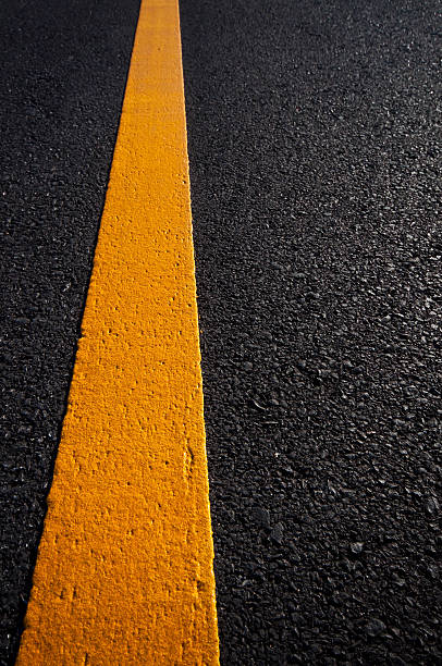 istock Asphalt road with separation yellow lines 493623936