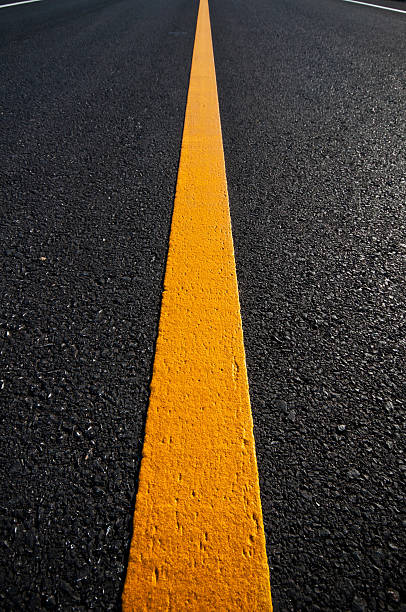 istock Asphalt road with separation yellow lines 493624056