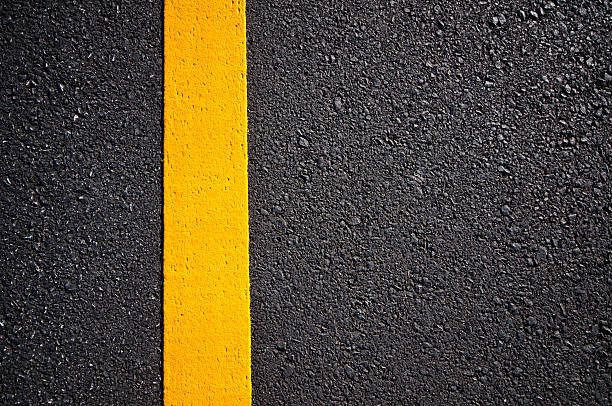 istock Asphalt road with separation yellow lines 493624614