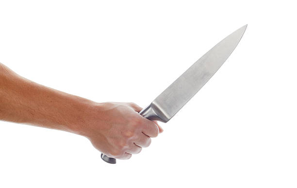 istock Male hand holding big silver kitchen knife 493626204