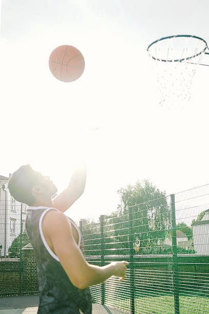 istock Basketball Player On The Court, Slam Dunking Ball 493629392