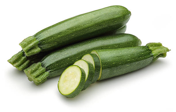 Zucchini with slices Zucchini with slices isolated on a white background courgette stock pictures, royalty-free photos & images