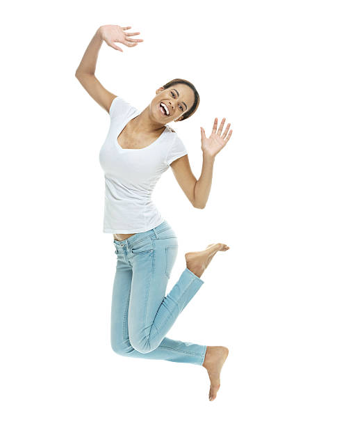 istock Cheerful casual woman jumping 493631196