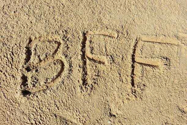 istock Best Friend Forever -  bff written on sand 493631354