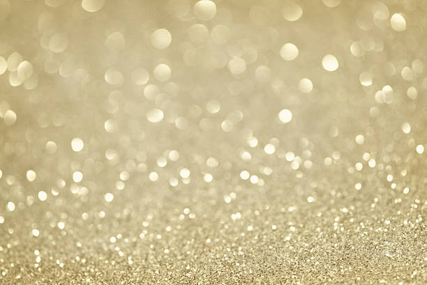 istock gold glittering christmas lights. Blurred abstract background 493631954