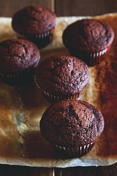 istock chocolate muffin on wooden table 493633000