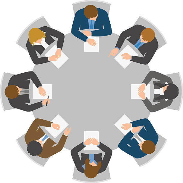 Overhead view of round table meeting Office workers meeting at round table from directly above conference table stock illustrations