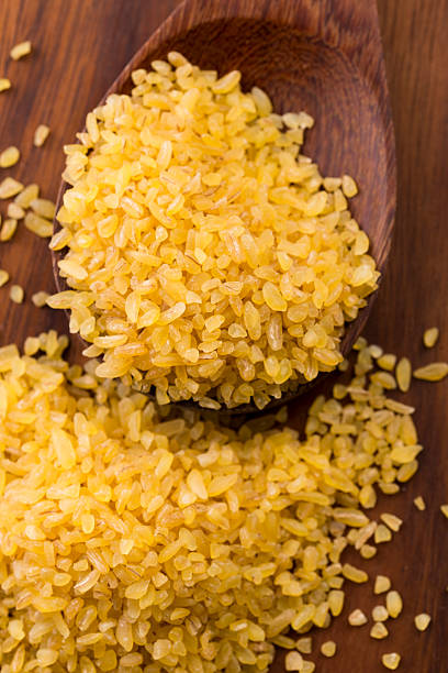 istock bulgur wheat in wooden spoon 493634249