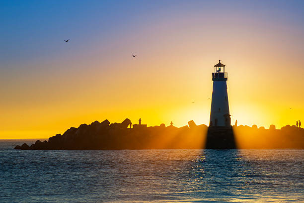 istock Light house with sunset in the background 493634987